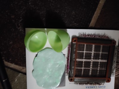 Ferrite core next to "glowey putty" core memory.