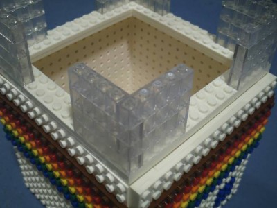 Studs on every face are outwards. Feet are dovetailed 1*4 tall bricks.