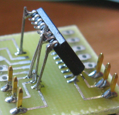 Wide SOIC soldered to narrow SOIC pads at an angle