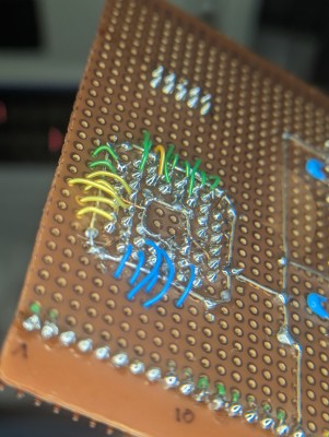 Power ring in the centre, ground ring on the outside.  Enamelled copper wire to the supply pins.