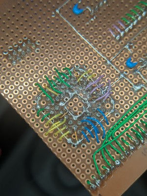 Had to use a really fine soldering tip towards the end.  The wires from the outer holes go to the inner pins, all of them arching over the ground ring.