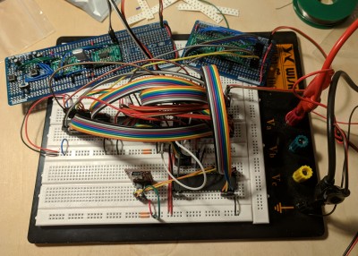 The breadboarded monster, with reset/clock and address decoding on their own protoboards, top-left and top-right respectively.