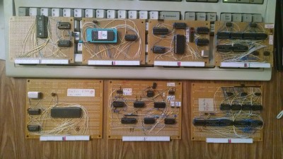 The 7 cards I've built so far.  Top row: 32K RAM, 16K EPROM, selectable baud rate serial card, address control card.<br />Bottom row: CPU card, status control card, data control card.