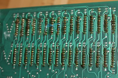 This is the image of the back side of the RAM chips with some questioning soldering and a wire run between two.